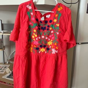 Beautiful embroidered flowers with slip underneath. Only worn once!